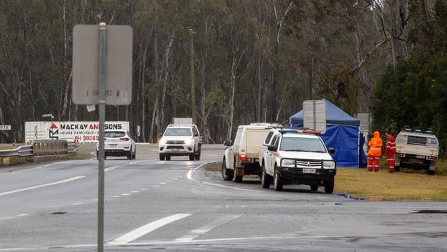 Police and SES crews set up a tent on the banks of Sandy Creek, at the D'Aguilar Hwy where the man’s body is believed to have been found. Picture: Dominic Elsome