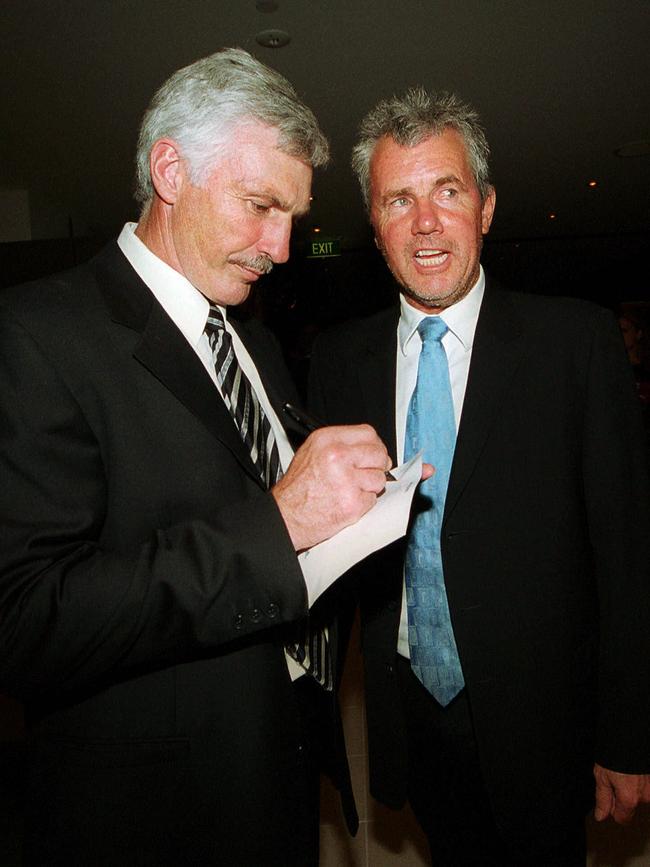 “Make it out to the horses please, Mick’. Daryl Braithwaite gets an autograph from Mick Malthouse.