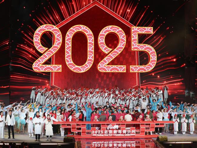 Chinese people celebrate during the New Year's countdown celebrations at Shougang Park on December 31, 2024 in Beijing, China. Picture: Lintao Zhang/Getty Images