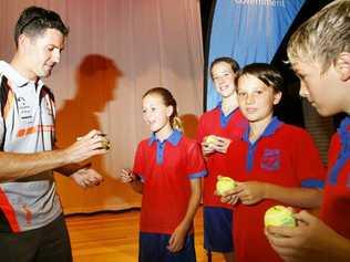 V8 Supercar champion Jamie Whincup signs autographs for Karalee State School captains (from left) Reegan Johnstone, Michaela Berlin, Robin Liney and Sebastian Scaroni for Super Sports Sign-On Day. 