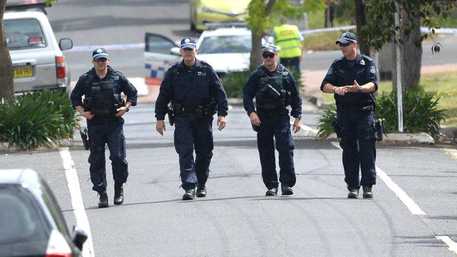 Police search a nearby street following Mejid’s shooting. Picture: Jeremy Piper