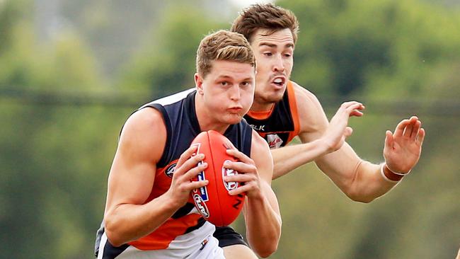 Riverina product Jacob Hopper marks in front of Giant Jeremy Cameron. Picture: Mark Evans