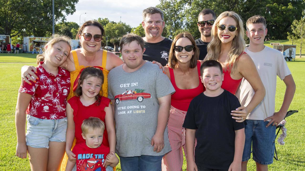 (Back from left) Tim Roberts, Max Roberts and Jack Glasby. (Front from left) Aria Thomas, Zoe Thomas, Evie Thomas, Freddy Thomas, Joe Rollins, Mandy Roberts, Ashley Glasby and Kirstie Glasby. Triple M Mayoral Carols by Candlelight. Sunday 8th December, 2024. Picture: Nev Madsen.