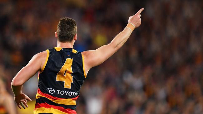 Josh Jenkins celebrates after kicking a goal during the preliminary final win over geelong at Adelaide Oval on Friday night. Picture: Daniel Kalisz/Getty Images)