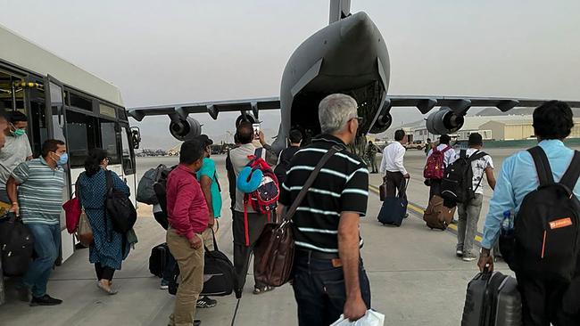 Indian Nationals prepare to board an Indian military aircraft at the airport in Kabul to be evacuated after the Taliban’s stunning takeover of Afghanistan. Picture: AFP