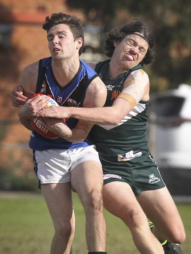 Unley’s Luke Heaslip marks in front of Seaton defender Callen Annett on Saturday. Picture: AAP/Dean Martin