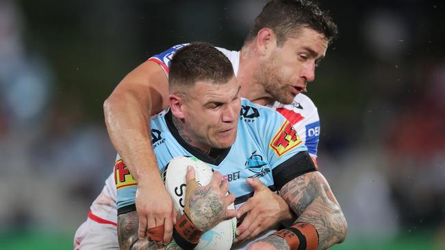 Josh Dugan is tackled by Andrew McCullough. Picture: Getty Images