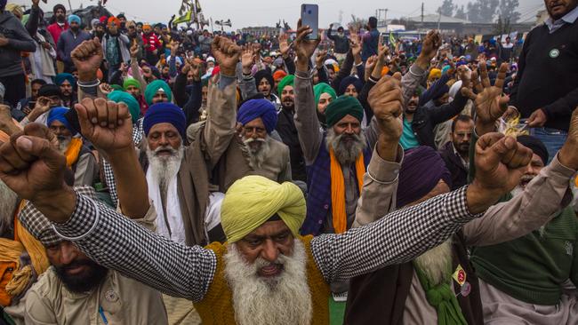 Indian farmers shout anti government slogans during a protest against new farm laws on December 12, 2020 at the Delhi-Haryana state border, India. Photo by Yawar Nazir/Getty Images