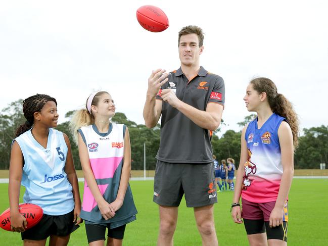 Under 15 girls teams from all over western Sydney played in first ever gala day. GWS star Jeremy Cameron at Blacktown International Sports Park with L-R: Harriet Owusu 12, Shelby Draper 13, Tahlia Ravello 12.. Photo: Adam Ward