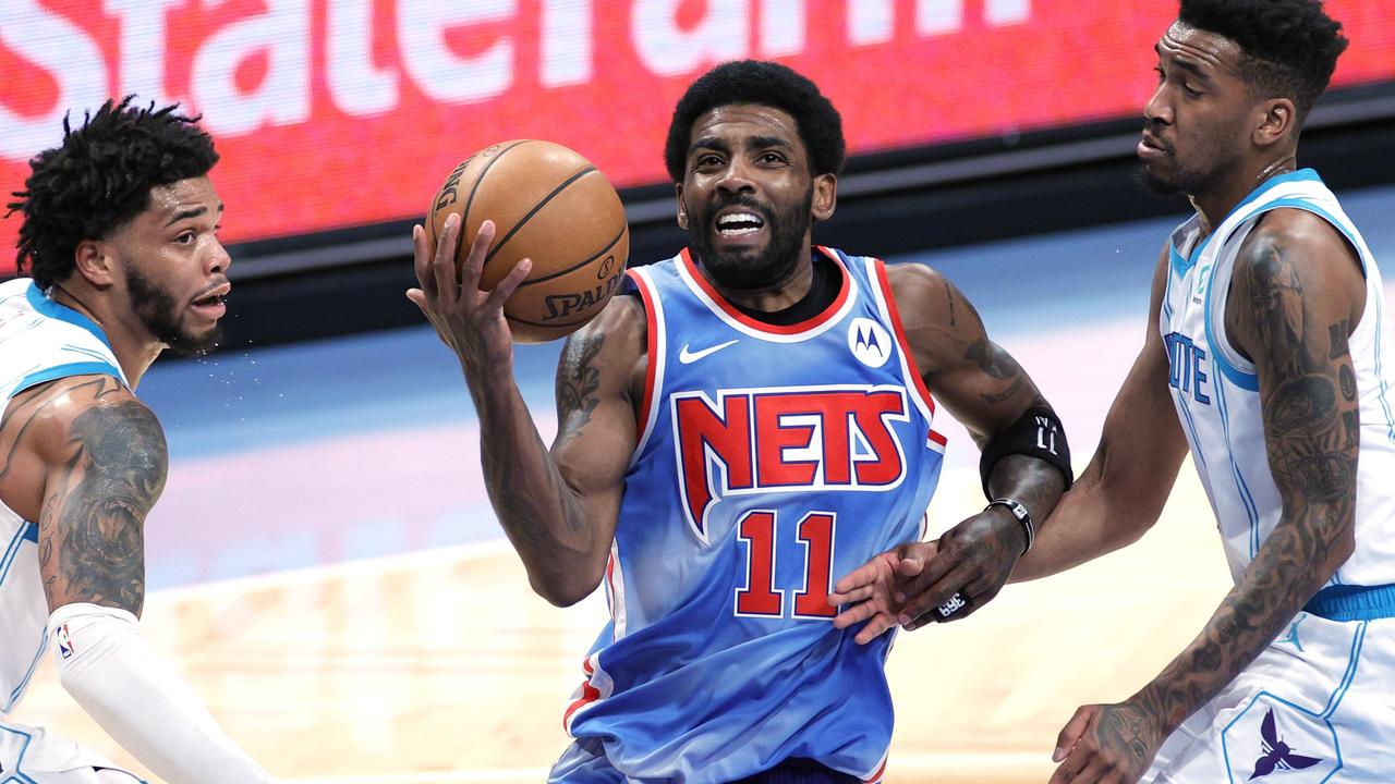 Kyrie Irving (middle) will be missing plenty of games. Sarah Stier/Getty Images/AFP