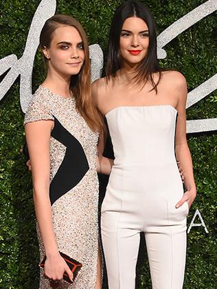 Kendall Jenner and Model of the Year winner Cara Delevingne attend the British Fashion Awards at the London Coliseum on December 1, 2014 in London, England. Picture: AP/Getty