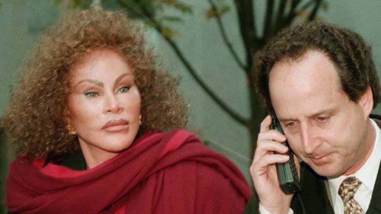 Jocelyne Wildenstein, wife of art dealer Alec Wildenstein, outside court with her lawyer Bernard Clair Mar and his giant mobile phone.