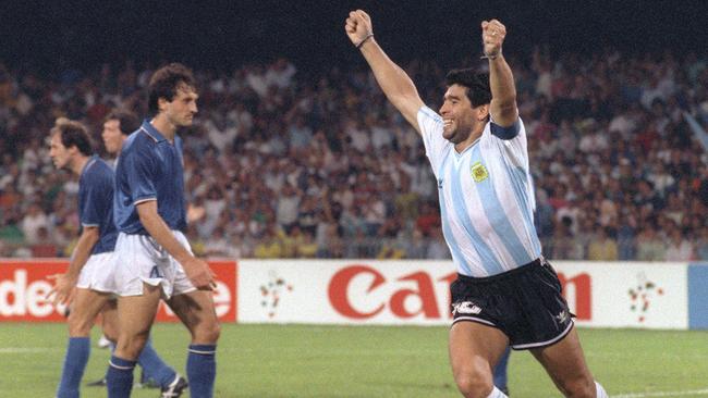 Maradona celebrates after teammate Claudio Caniggia’s goal against Italy at the World Cup in 1990. Picture: AFP