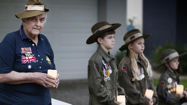 David Doughty 66, will stand and hold candles with his grandchildren Riley 10, Kaitlyn, 9 and William, 7 outside his house for the Anzac Day Dawn Service. Picture: David Caird