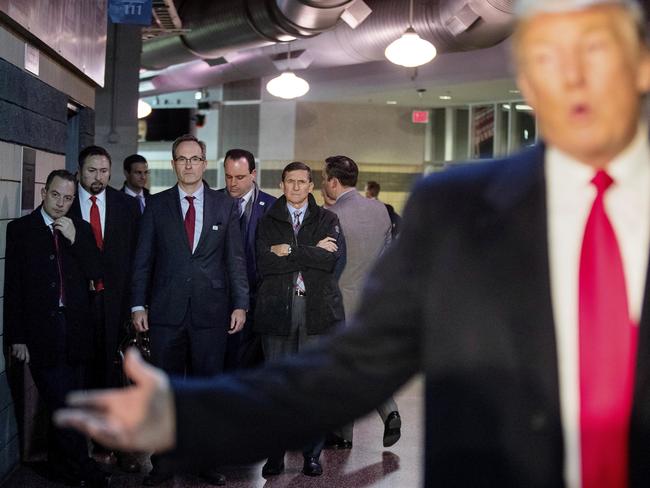 Donald Trump with Chief of Staff Reince Priebus, left; Jason Miller, a senior adviser, second from left; Boris Epshteyn, a spokesman for Trump, fourth from left, and Michael Flynn, Trump's nominee for National Security adviser, fifth from left, listen as Trump speaks. Picture: AP