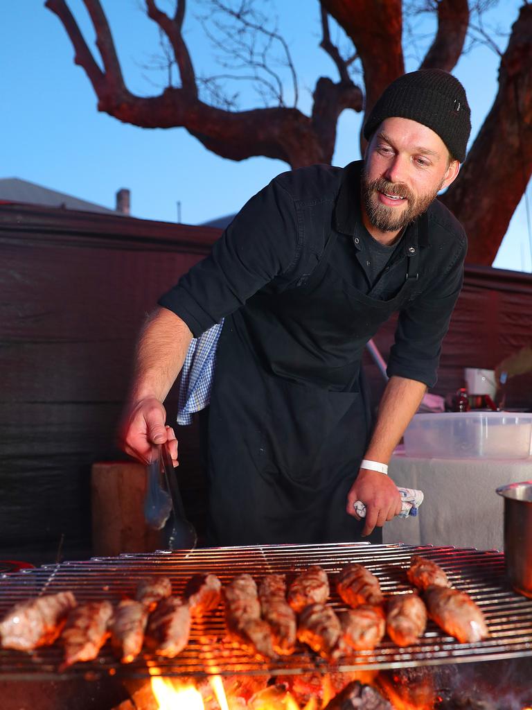 Chef Asher Gilding cooking wallaby backstraps at the Winter Feast. Picture: SAM ROSEWARNE