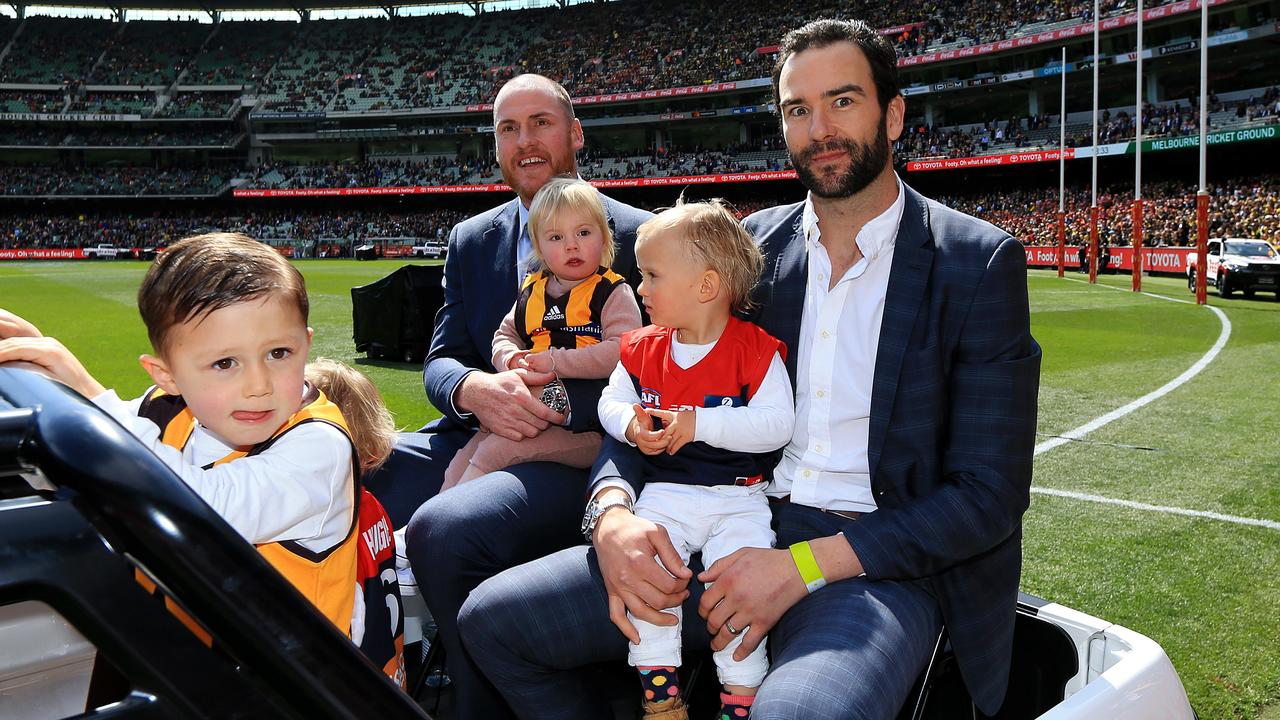 Jarryd Roughead and Lewis enjoy their retirement lap together. Picture: Mark Stewart