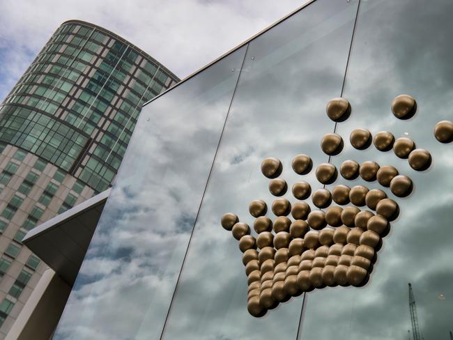 The Crown Casino logo adorns the side of their casino in Melbourne on April 9, 2019. - Australian gambling giant Crown Resorts on April 9 confirmed a takeover offer from US gaming group Wynn Resorts, estimated to be worth more than USD 7 billion, sending the firm's shares surging by a quarter. (Photo by William WEST / AFP)