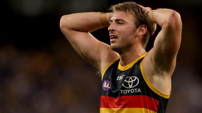 Daniel Talia of the Crows reacts after their loss during the Round 21 AFL match between the West Coast Eagles and the Adelaide Crows at Optus Stadium in Perth, Sunday, August 11, 2019.  (AAP Image/Richard Wainwright) NO ARCHIVING, EDITORIAL USE ONLY