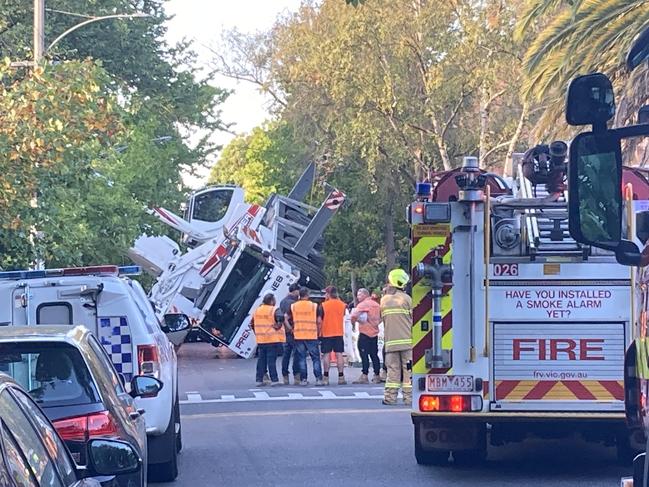 Crane topples over in South Yarra