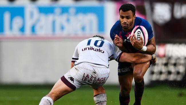 Stade Francais scrumhalf Will Genia vies with Bordeaux fly half Simon Hickey.