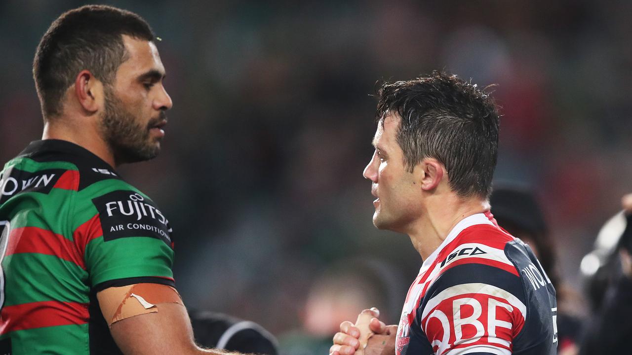 Cooper Cronk shares a moment with Greg Inglis after GI’s second last game of rugby league for the Rabbitohs.