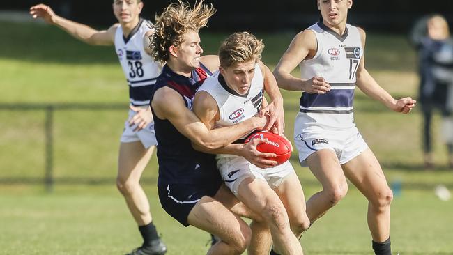 GOT HIM: Josh Worrell lays a strong tackle for Sandringham Dragons against Northern Knights this year. Picture: VALERIU CAMPAN.