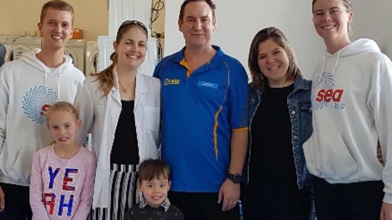 OPENING IN GYMPIE: Sunshine Coast Washers and Fridges Lea-Anne Buck (second left), John Buck (centre), their children Jane and Patrick with the Sea FM Crew..