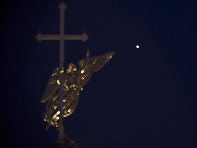 The planet Mars seen over a city landmark in St Petersburg, Russia.