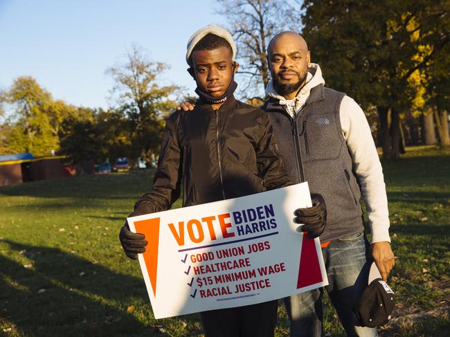 Jerome Barnes with his father, made a powerful statement at the Biden rally. Picture: Angus Mordant