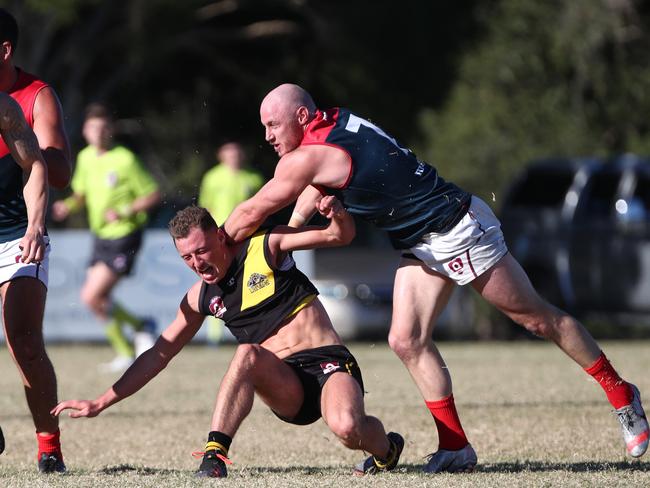 Brody Haberfield of Surfers Paradise clashes with Labrador's Blair Rubock. Photograph: Jason O'Brien