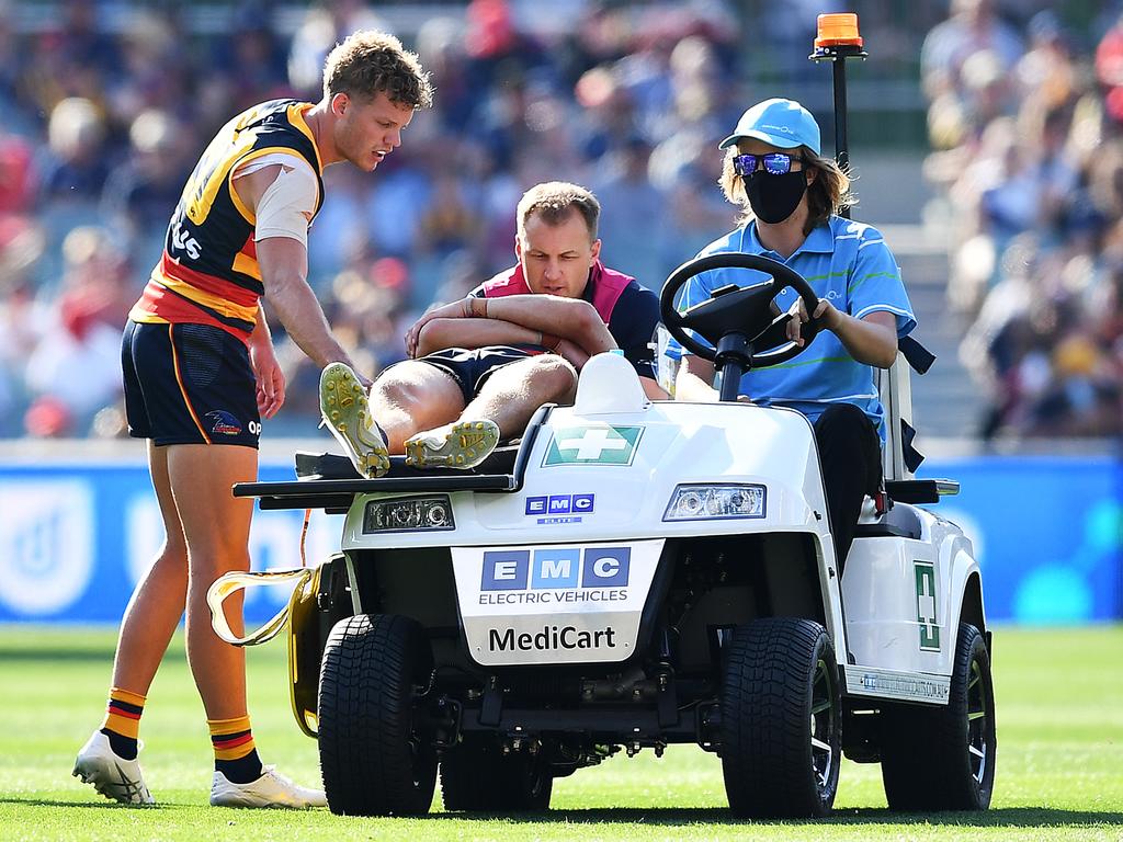 Jake Kelly leaves the ground after his head clash with Patrick Dangerfield.