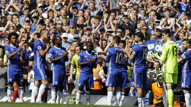 Chelsea's John Terry, second left, walks through a guard of honour from his teammates