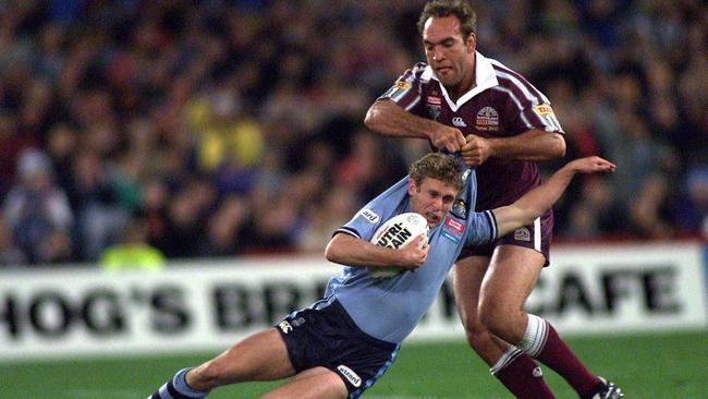 Brett Hodgson is manhandled by Gorden Tallis during an Origin game.