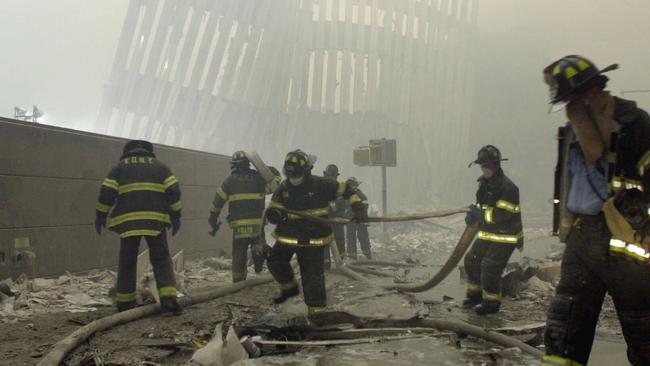 New York City firefighters work amid debris after the terrorist attacks in September 11, 2001. Picture: Mark/Lennihan/AP