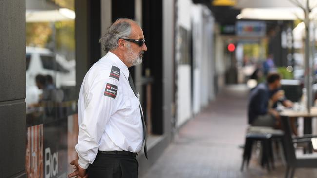 A security guard stationed outside of Bici Espresso. Picture: Naomi Jellicoe