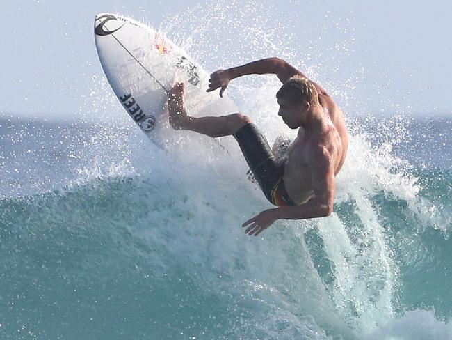 Flocks of surfers hit Snapper Rocks to make the most of the swell generated by tropical cyclone Tatiana. Mick Fanning. Picture by Scott Fletcher