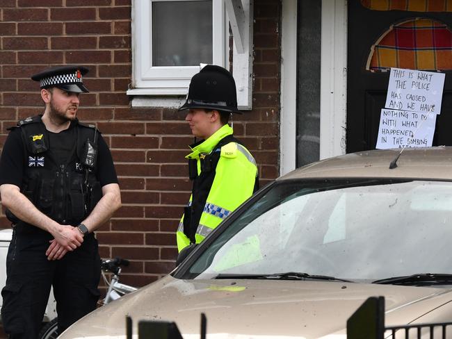 Police officers stand outside a property in Quantock Street in the Moss Side area of Manchester where a raid was carried out. Picture: Getty