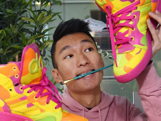 Victorians are being encouraged to repair and reuse items to reduce landfill. The Sneaker Laundry had restored thousands of shoes. Founder Eugene Cheng repairing some shoes. Picture: Josie Hayden