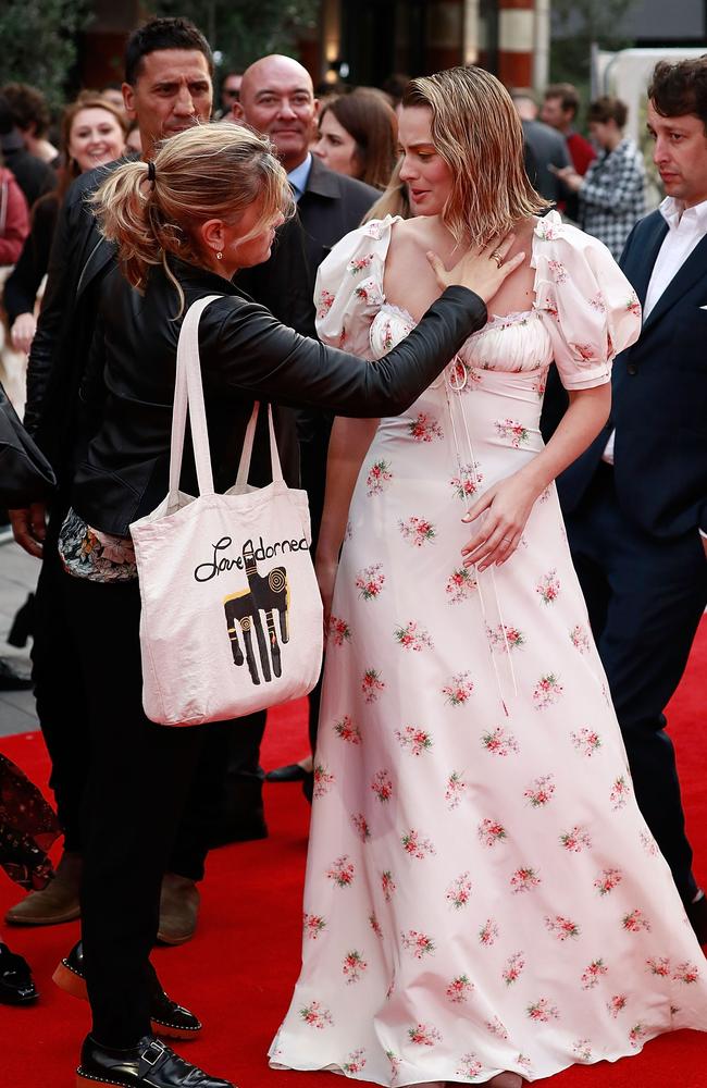 Assistants were on hand to help Robbie with her look. Picture: Getty