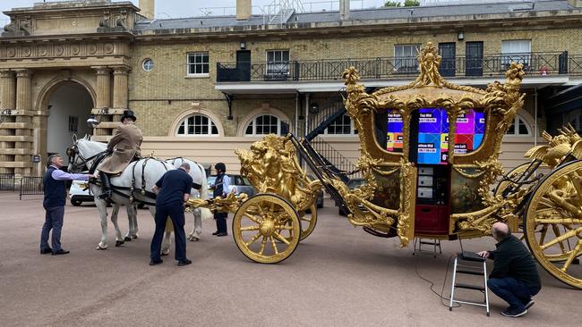 BEFORE: Producers from Treatment Studio rig the 260-year-old carriage to project a hologram of the Queen. Picture: Supplied.