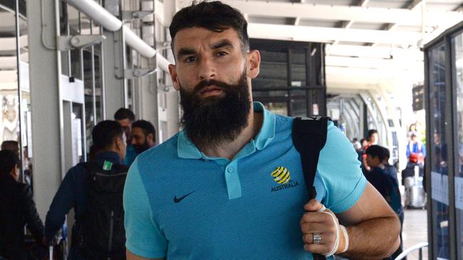 Socceroos captain Mile Jedinak arrives back in Sydney on Sunday following the flight from Honduras.