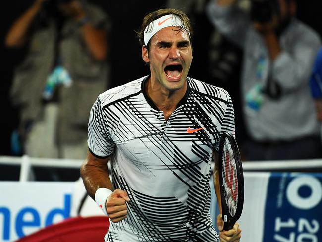 Roger Federer of Switzerland celebrates his win in the Mens Singles Final against Rafael Nadal of Spain on day fourteen of the Australian Open, in Melbourne, Australia, Sunday Jan. 29, 2017.  (AAP Image/Tracey Nearmy) NO ARCHIVING, EDITORIAL USE ONLY