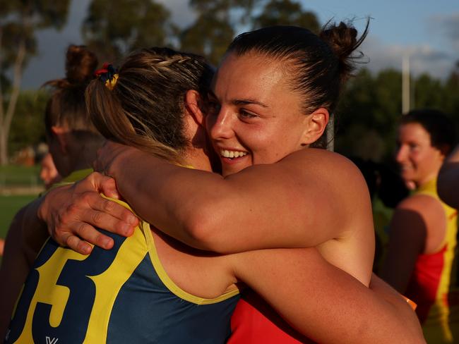 MELBOURNE, AUSTRALIA – OCTOBER 20: Ebony Marinoff of the Crows (R) hugs Anne Hatchard of the Crows after winning the round eight AFLW match between Collingwood Magpies and Adelaide Crows at Victoria Park, on October 20, 2024, in Melbourne, Australia. (Photo by Daniel Pockett/Getty Images)