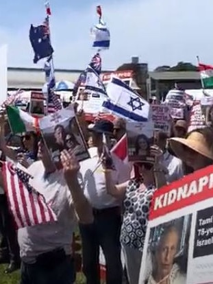 Supporters waved flags from many countries and held signs of people held captive. Picture: Tamaryn McGregor