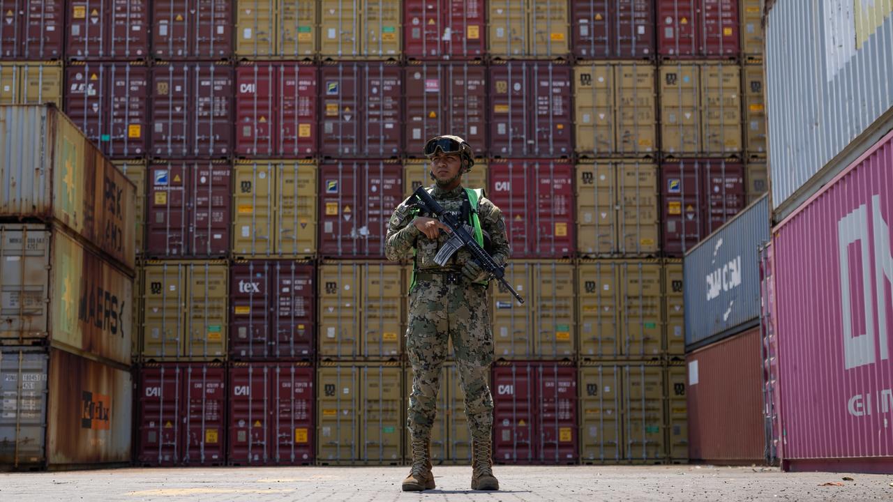 Mexico's Navy watch over containers at the port of Lazaro Cardenas that have a high risk of containing drugs. Picture: Jason Edwards