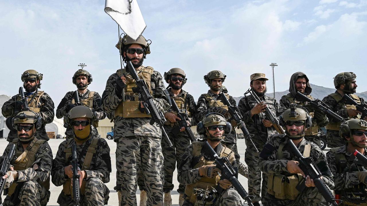 Members of the Taliban Badri 313 military unit take a position at the airport in Kabul.