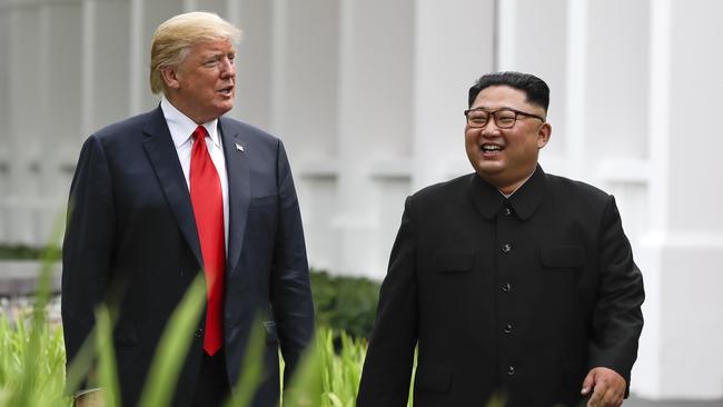 The leaders enjoy a post-lunch stroll at the Capella Hotel. Picture: AP