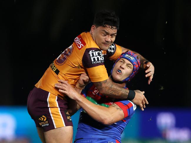 Issac Luke clobbers Kalyn Ponga. Picture: Cameron Spencer/Getty