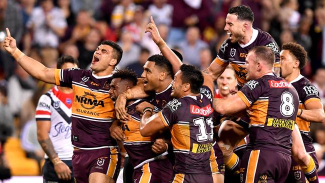 James Segeyaro (second from left) celebrates his try with teammates. Picture: Bradley Kanaris/Getty Images